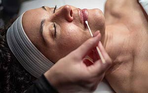 Woman receiving facial enhancement