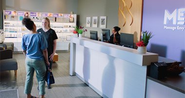 Client and franchise employee chatting in the lobby