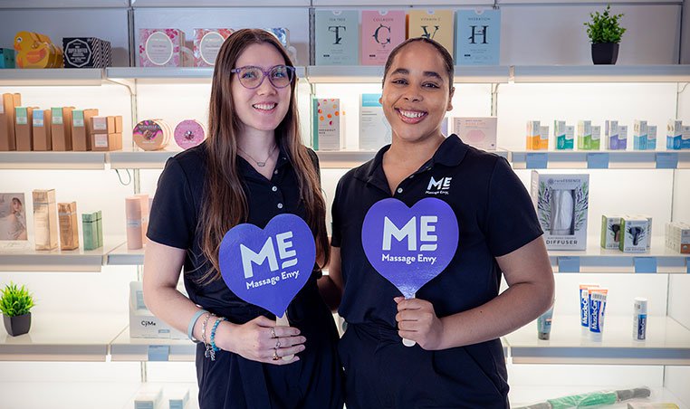 Two ME employees smiling