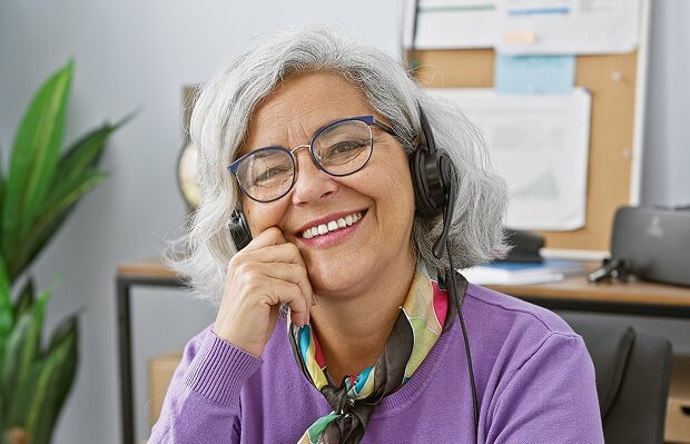 Woman smiling at desk