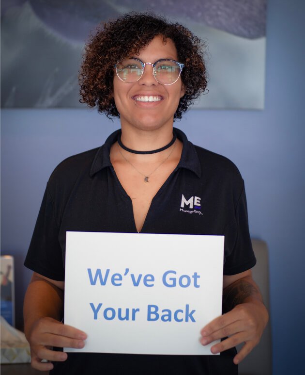 Manager holding sign 'We've got your back'