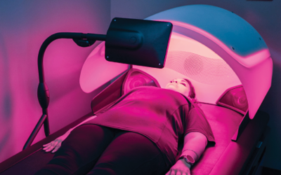 Woman lying down during HyrdoWave Custom Massage service. 