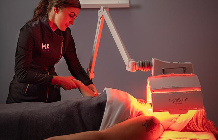 Close-up of a woman receiving a Clarifying Acne Nourishing Light Treatment. 