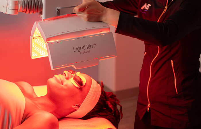 Close-up of a woman receiving a Brightening Nourishing Light Treatment. 