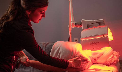 Woman receiving Age-Defying Nourishing Light Treatment. 