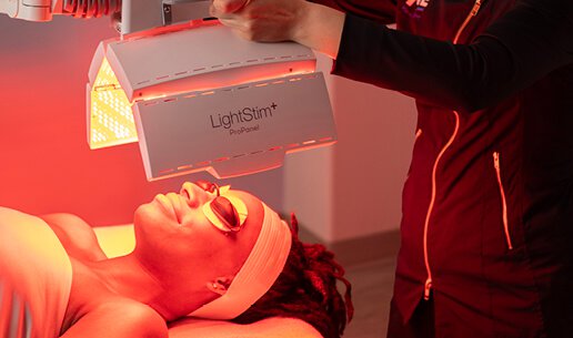 Woman receiving Brightening Nourishing Light Treatment. 