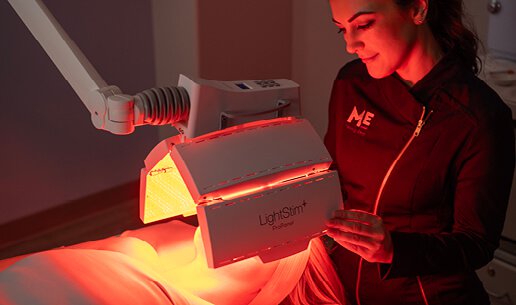Woman receiving Calming Nourishing Light Treatment. 