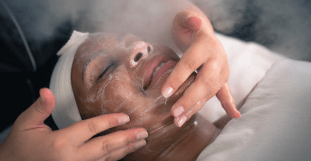 Woman receiving oxygenating treatment service at Massage Envy clinic. 