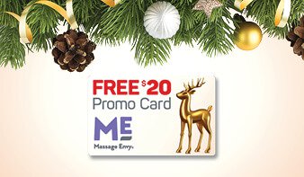 Free $20 promo card from Massage Envy. Promo card with holiday decorations positioned just above. 
