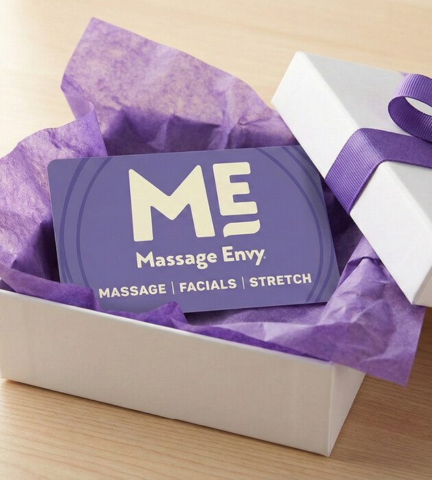 Massage Envy gift card inside of a gift box. 